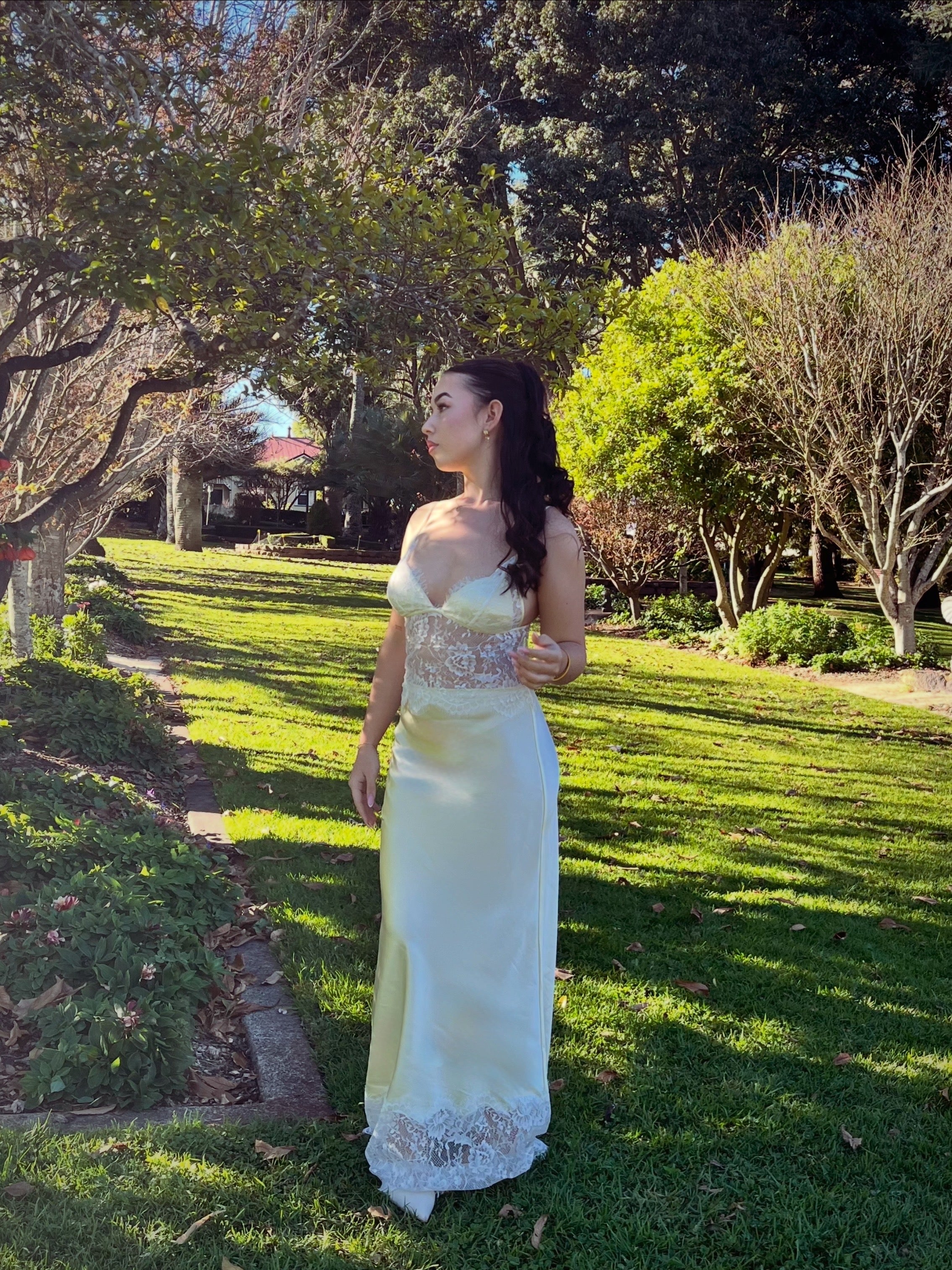 Maxi Dress with butter yellow silk blend satin skirt and lace waist panel and bodice along with white lace trim at the hem of the skirt.